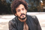 Nagarjuna and Akhil film, Nagarjuna and Akhil film news, nagarjuna s 100th film will have akhil in a crucial role, Nagarjuna 100th film