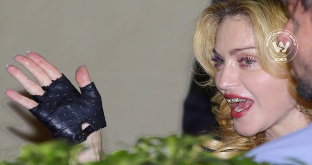 What&#039;s Madonna hiding behind that smirk?},{What&#039;s Madonna hiding behind that smirk?